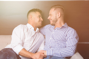 Two attractive guys at home. Comfort and relaxation. 