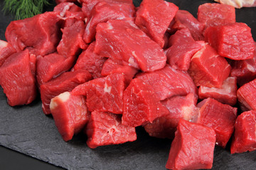 Raw Meat on the Black Background