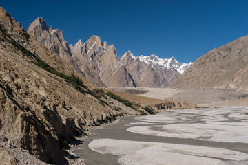 Obraz premium Trango tower family, Lobsang spire and river, K2 trek, Pakistan