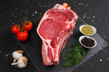 Raw Steak Beef on the Black Background