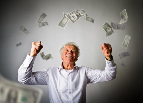 Old man in white and falling dollar banknotes