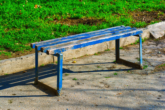 Old painted wooden bench in the park