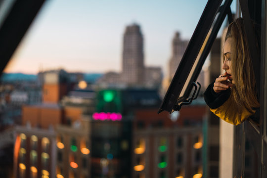 Woman smoking in window