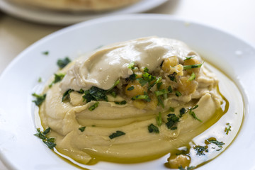 Hummus plate with parsley 