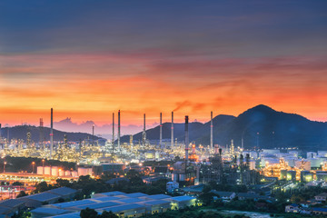 Landscape of city and oil refinery plant at twilight