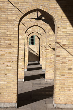 Narrow vaulted passage of clay brick in mosque, Yazd, Iran.