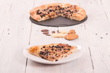 Sweet chocolate pizza with cookies. 