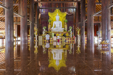 White jade Buddha in Pa Lahan Sai temple with reflection , Buriram Province , Thailand