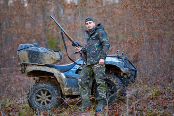 Hunter on ATV in the forest