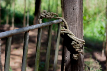 old rope on wooden pole in the garden