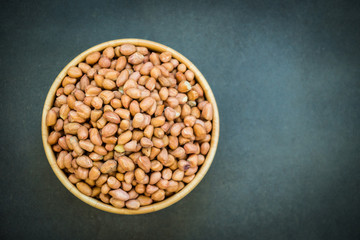 Peanuts in wooden bowl