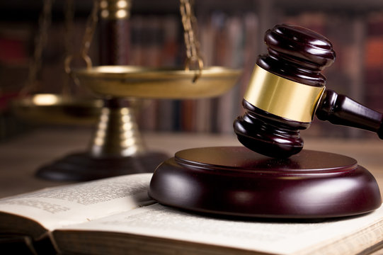 Wooden Judges gavel ,golden scales justice. Law concept