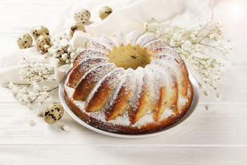 Easter cake, tender flowers, eggs for Easter. The concept of Easter