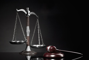 Wooden Judges gavel ,golden scales of justice. Legal office.