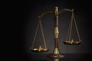 Wooden Judges gavel ,golden scales of justice. Legal office.
