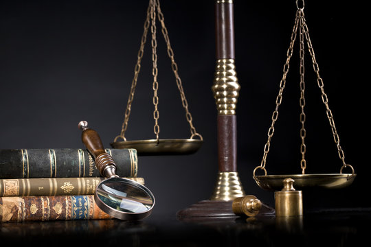 Wooden Judges gavel ,golden scales of justice. Legal office.