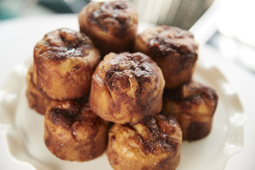 Display Of Freshly Baked Cinnamon Buns In Coffee Shop