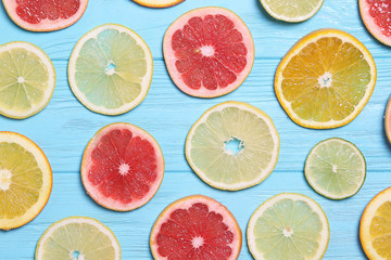 Oranges, lemons, grapefruit slices on the background