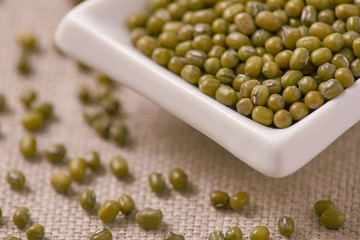 Green beans. White cup. Neutral background. Healthy Eating