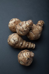 Harvest artichoke on a black background.