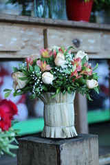 natural flower arrangement with roses and alstroemerias