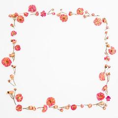 Floral frame made of roses buds on white background. Valentines day composition. Flat lay, Top view
