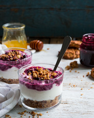 portioned cheesecake in a glass with jam