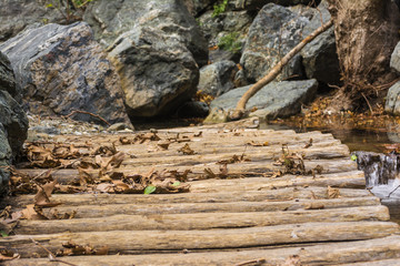 Old wooden bridge from logs in the gorge of Richtis at winter, Crete