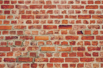 old wall brick background.  Mortar. Orange wall color background. Vintage wall