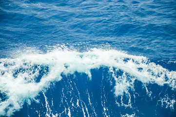 Foaming wave in front of the bow of a ship