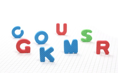 Alphabet letters and numbers pile isolated on white checkered background