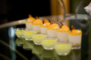 Glass shots  pastry. wedding catering food. mini canapes food.  tasty dessert. Beautiful decorate catering banquet table.  snacks and appetizers. wedding celebration