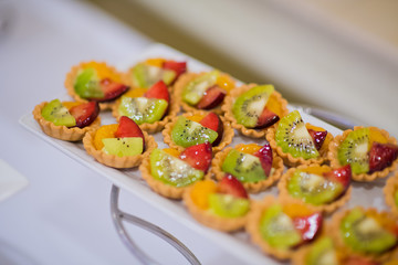 wedding catering food. mini canapes food.  tasty dessert. Beautiful decorate catering banquet table.  snacks and appetizers. wedding celebration