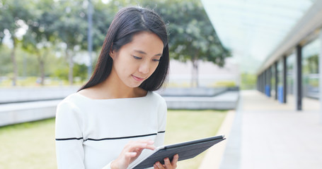 Asian Woman holding with digital tablet computer