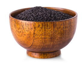 wild rice in wooden bowl on white background.