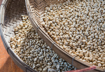 coffee beans on wood basket