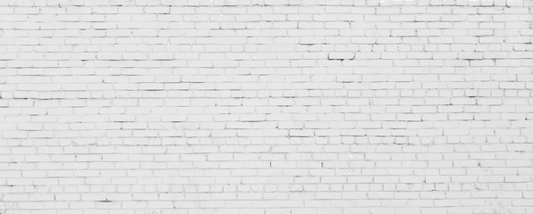 Brick wall painted with white paint.