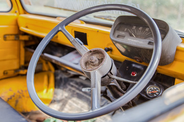 interior of old car with old steering wheel