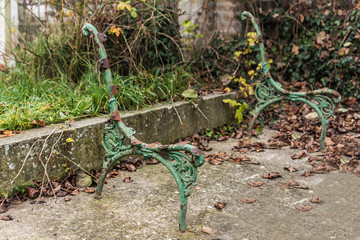 Details of an old ruined metal bench