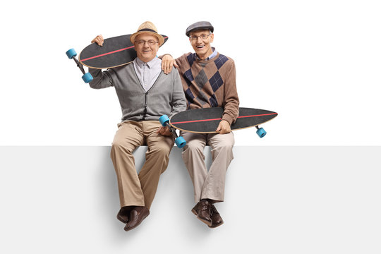 Seniors with longboards sitting on a panel - Powered by Adobe