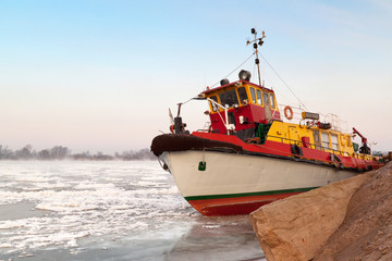Fototapeta premium Wisla view with boat on ice.