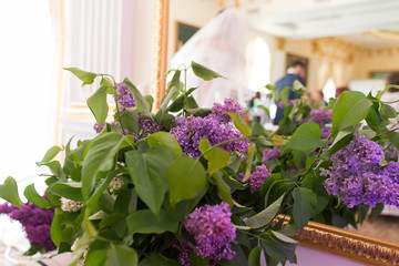 Violet wedding decoration with flowers of lilac 