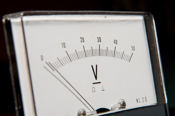 Detail of an analog voltmeter, pointer scale
