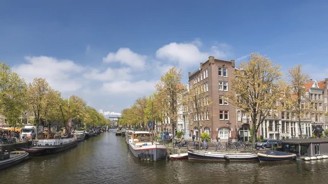 Amsterdam city skyline timelapse at canal waterfront, Amsterdam, Netherlands 4K Time Lapse