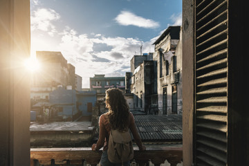 Back view of beautiful woman looking the city.