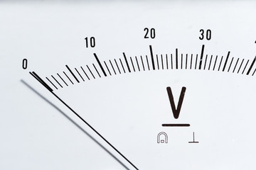 Detail of an analog voltmeter, pointer scale