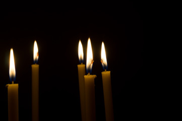 marvelous candle light on dark background to help lead people to the goal
