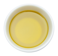 Top view of olive oil bowl isolated on white