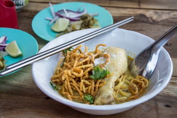 Curried Noodle Soup (Khao soi) with chicken , Traditional of Northern Thai food.