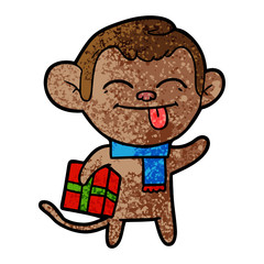 Obraz na płótnie Canvas funny cartoon monkey with christmas present